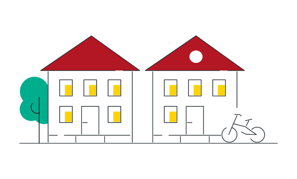Deux maisons avec un vélo garé devant elles.