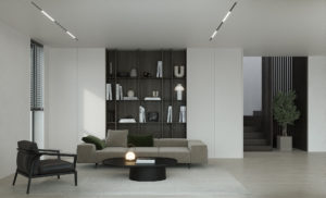 Un salon moderne avec des murs blancs et des meubles noirs.